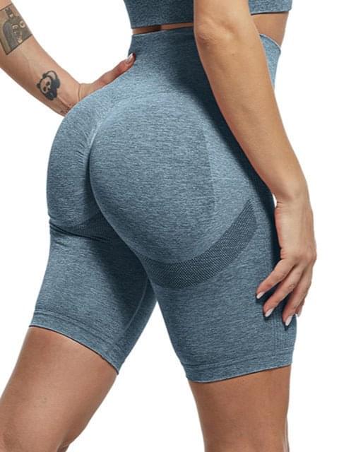 Model wearing Premium Fitness Yoga Shorts in Aqua Blue, showcasing comfort and style during a workout.   00000Y1WRRWY1RI