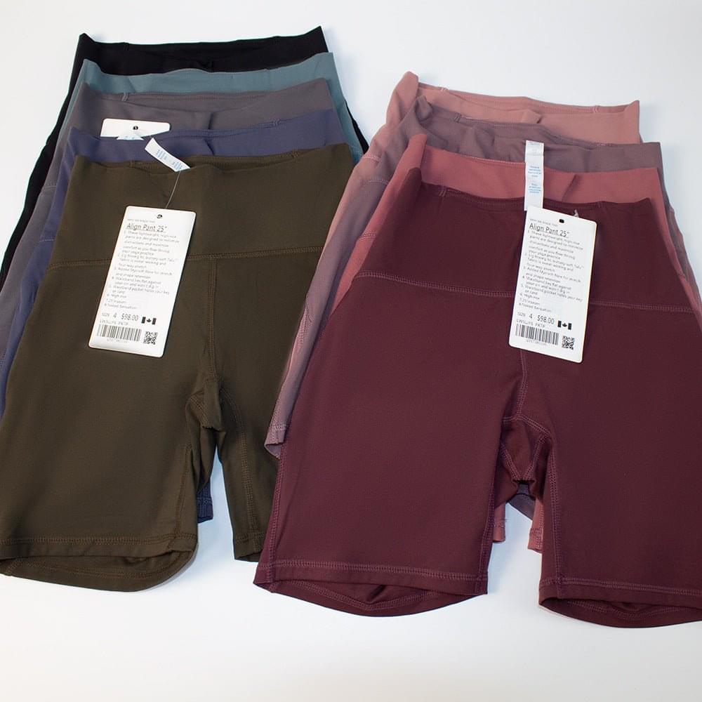Woman wearing quick dry yoga shorts with high waist and butt lift design during workout