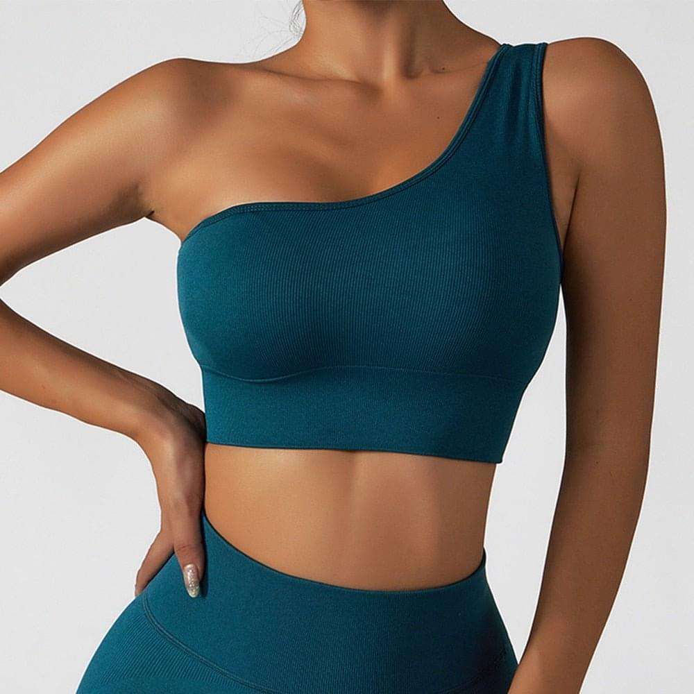 Woman wearing summer sexy oblique shoulder yoga clothes top with asymmetrical design and irregular straps